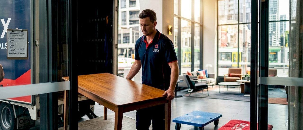 Removalist unloads furniture in Melbourne CBD lobby
