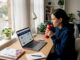 Woman researching moving companies at desk