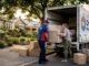 Movers loading couch onto truck