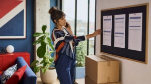 Woman reviewing moving cost estimates at home