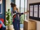 Woman reviewing moving cost estimates at home