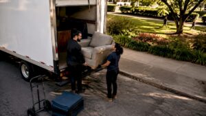 Labour-only movers loading furniture into rental truck