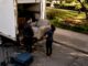 Labour-only movers loading furniture into rental truck