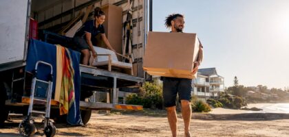 Two movers loading truck at suburban home Australian style
