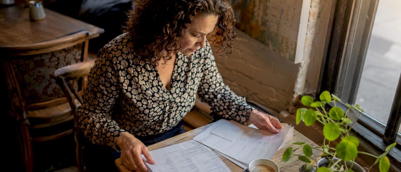 Person reviewing moving cost paperwork