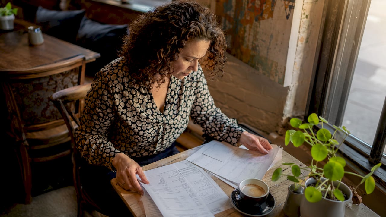 Person reviewing moving cost paperwork