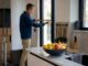 Man measuring doorway for moving access
