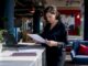 Office manager reviewing relocation brief paper