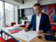 Commercial move manager reviewing relocation plans