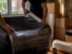 Movers wrapping furniture with protective blankets