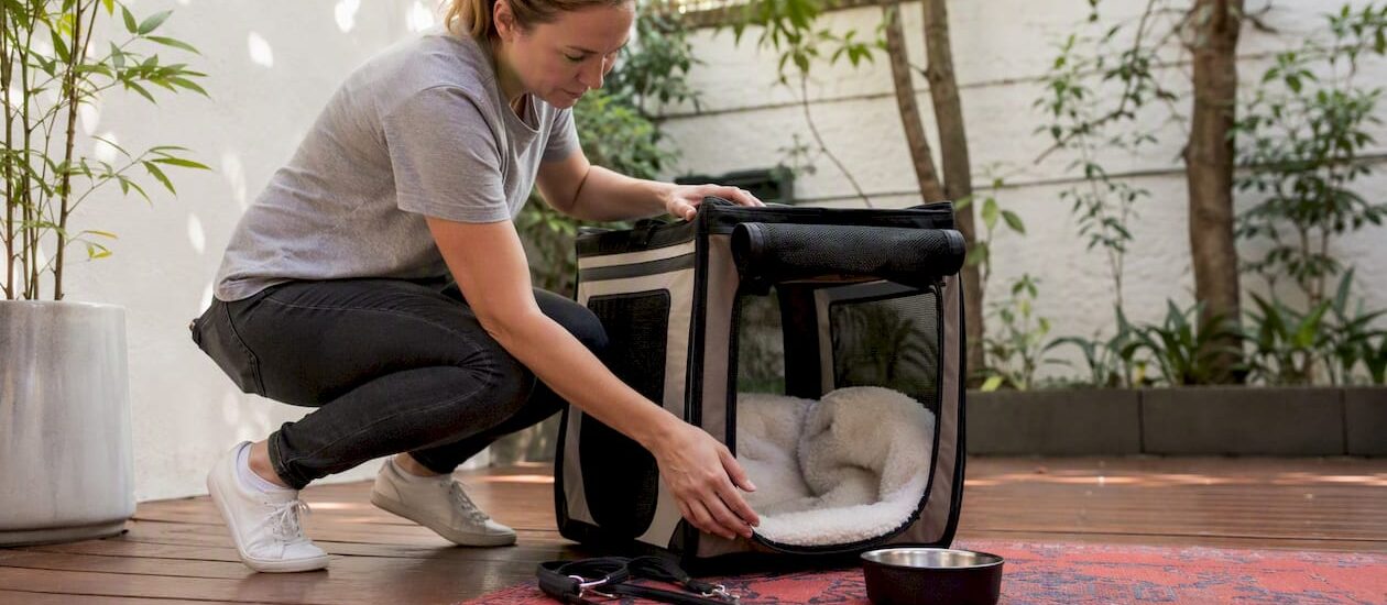 Pet travel crate being prepared indoors
