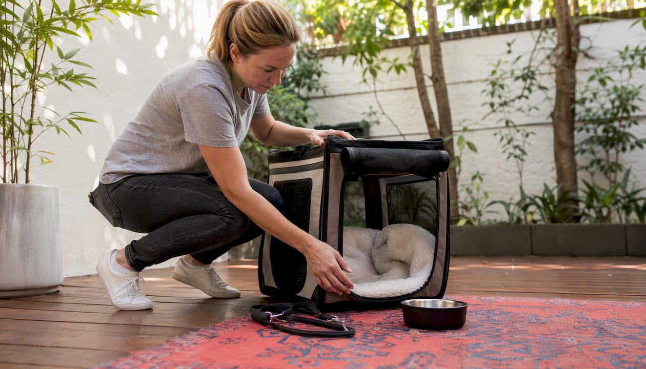 Pet travel crate being prepared indoors