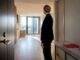 Relocation manager inspecting Melbourne apartment