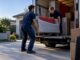 Removal crew loading a small moving truck