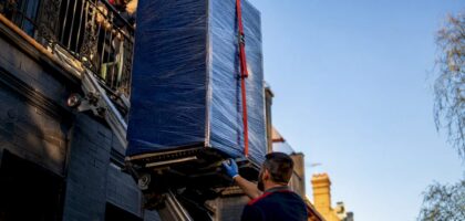 Wrapped furniture lifted beside Melbourne terrace