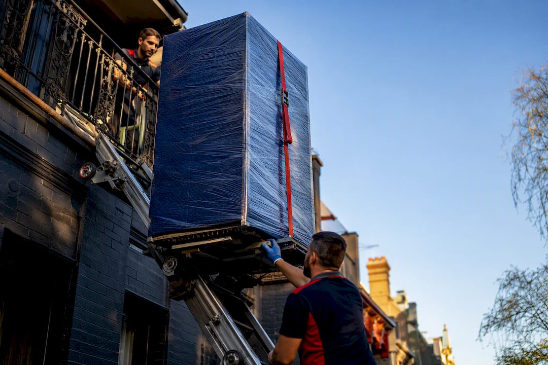 Wrapped furniture lifted beside Melbourne terrace