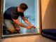 Homeowner measuring doorway for moving access