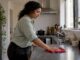 Tenant wiping a rental kitchen counter