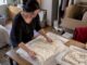 Heirloom garments being prepared for moving