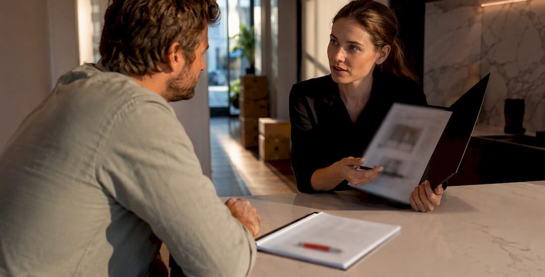 Homeowner reviewing mover coverage with coordinator