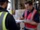 Warehouse receiver signing a delivery docket